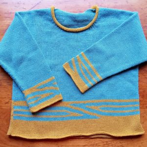 Pull enfant mixte, graphisme couleur, manches longues, col rond tricoté en jersey.